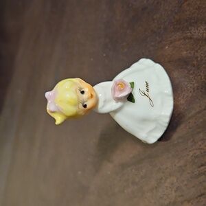 June Figurine with Pink Flower